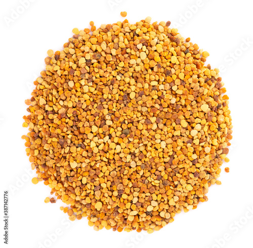 Flower pollen grains, isolated on white background. Pile of bee pollen or perga. Top view.