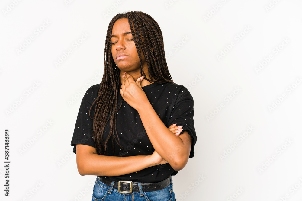 Young african american woman isolated on white background suffers pain in throat due a virus or infection. Young african american woman isolated on white background suffers pain in throat due a virus or infection.