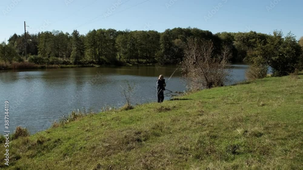 Man fisherman gets a spinning rod from the river. Slow motion. Man fisherman gets a spinning rod from the river. Slow motion.