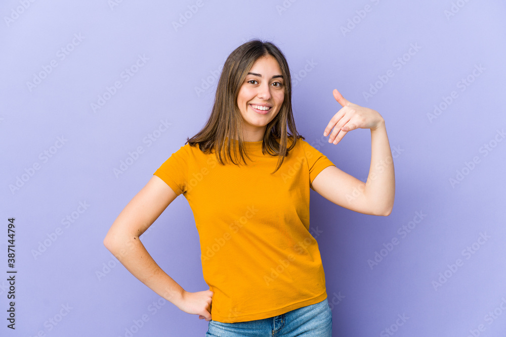 Young caucasian woman laughing about something, covering mouth with hands. Young caucasian woman laughing about something, covering mouth with hands.