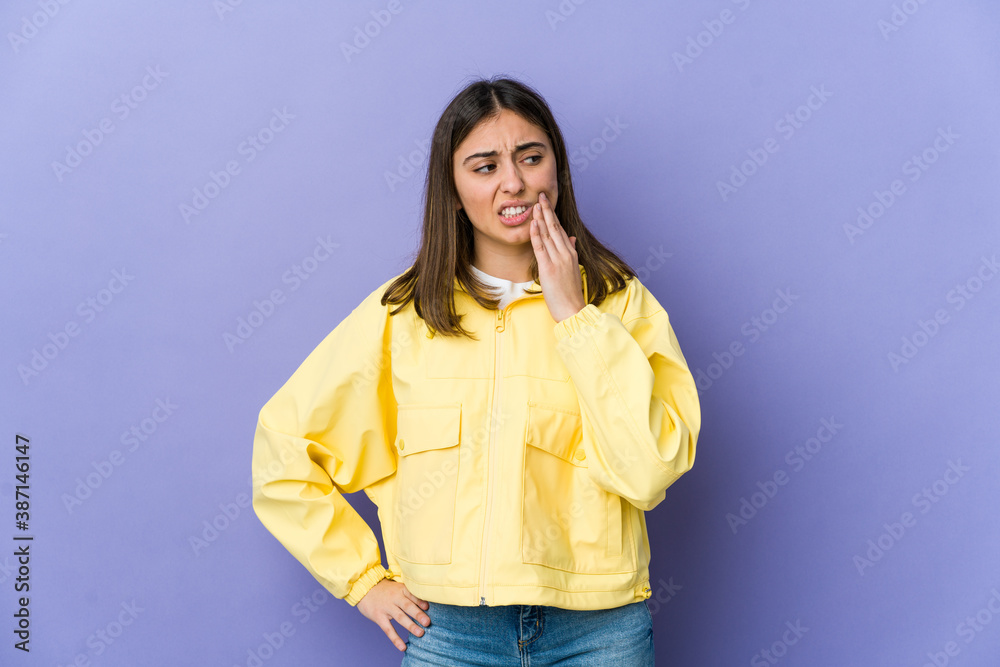 Fototapeta premium Young caucasian woman having a strong teeth pain, molar ache.