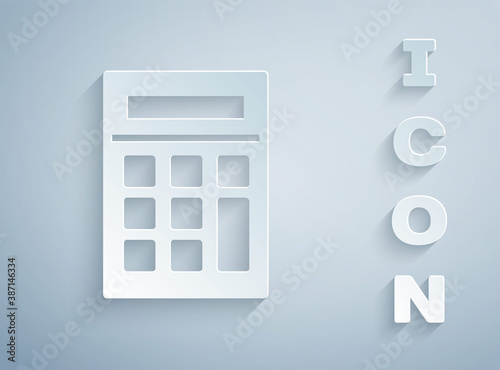 Paper cut Calculator icon isolated on grey background. Accounting symbol. Business calculations mathematics education and finance. Paper art style. Vector Illustration.
