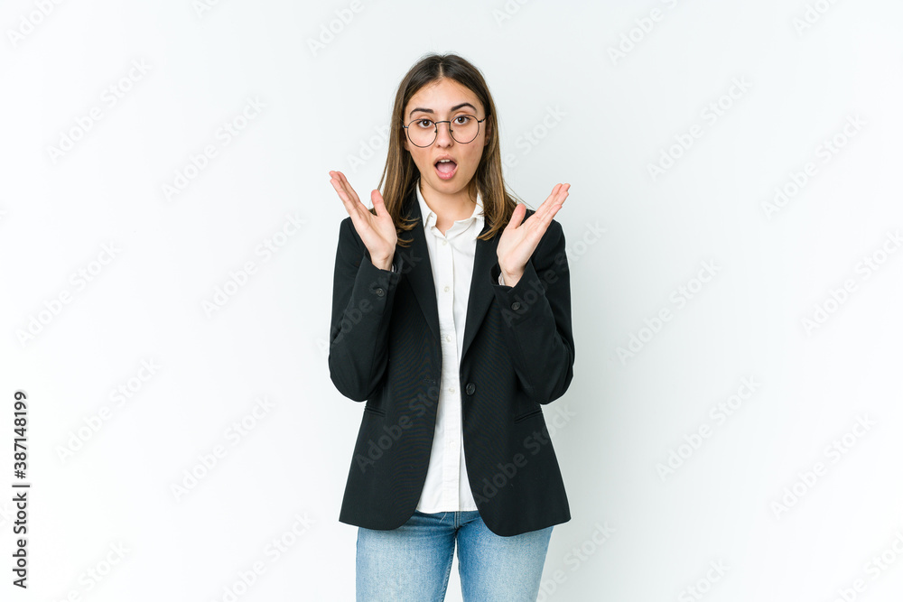 Young caucasian business woman surprised and shocked. Young caucasian business woman surprised and shocked.