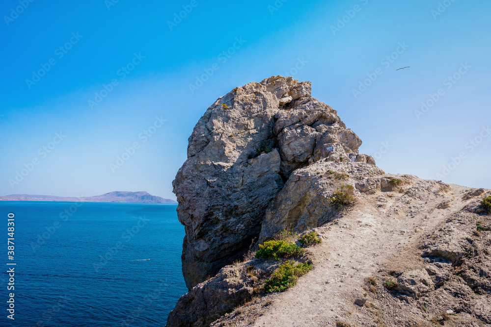 Beautiful seascape, panorama of Cape Kapchik to the Golitsyn trail and the Blue Bay of the Black sea. Landscape of the sea coast.