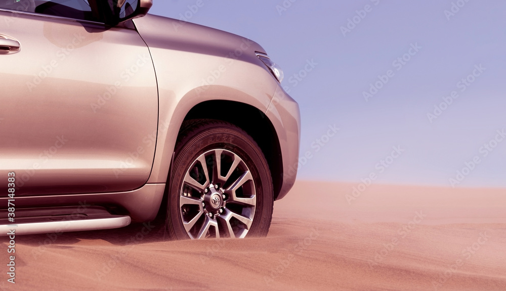 Close up of a golden car stuck in the sand in the Namib desert. Walvis Bay. Namibia. Africa 07.02.2020