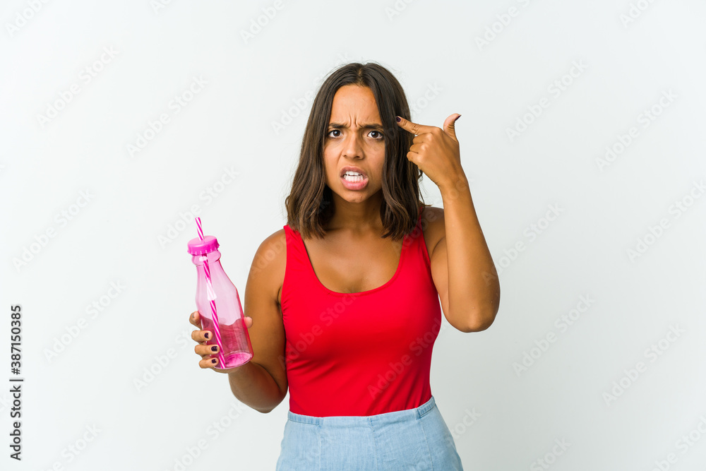 Young latin woman holding a milkshake isolated on white background Young latin woman holding a milkshake isolated on white background