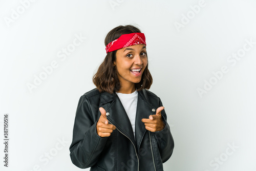 Young latin rocker woman isolated on white background