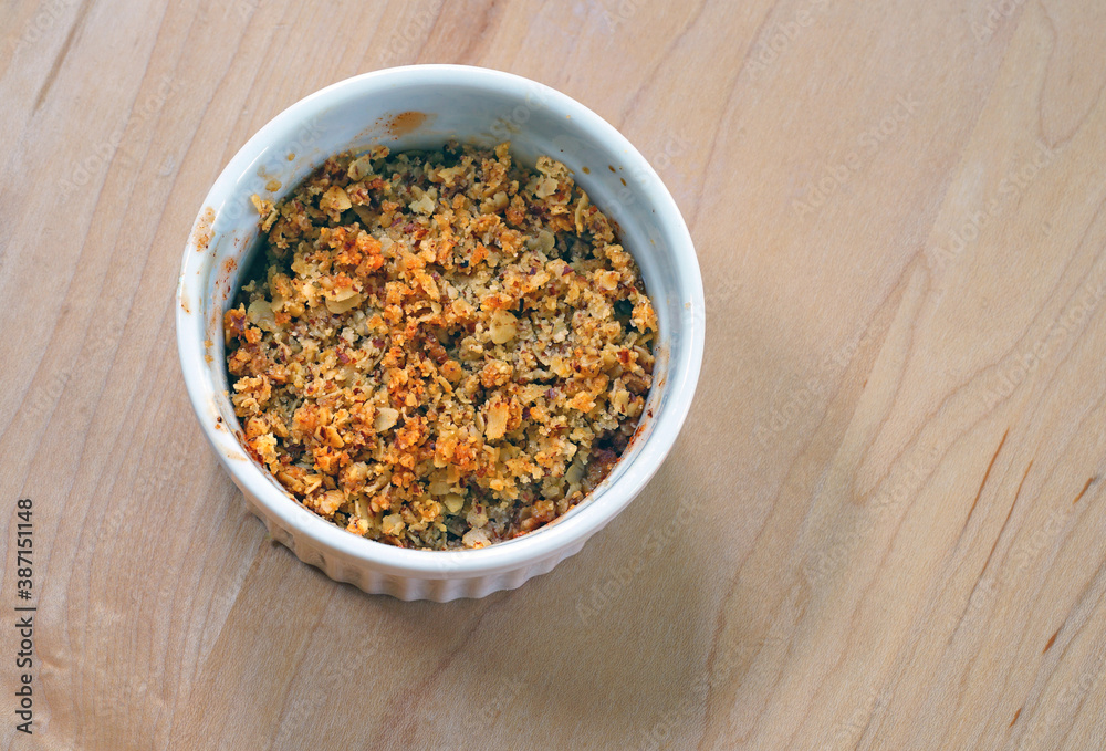 Apple and oat crumbles in individual ramekins