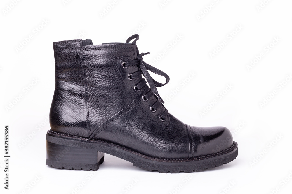 Black leather boot isolated on white background. Stylish women's shoes Black leather boot isolated on white background. Stylish women's shoes