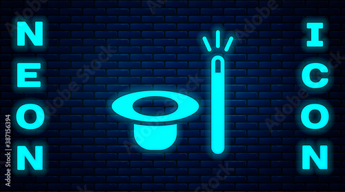 Glowing neon Magic hat and wand icon isolated on brick wall background. Magic trick. Mystery entertainment concept. Vector.