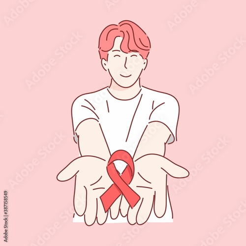 Man holding red ribbon. HIV awareness in world aids day and world sexual health day concept .