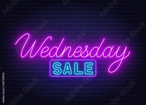 Wednesday Sale neon sign on brick wall background .