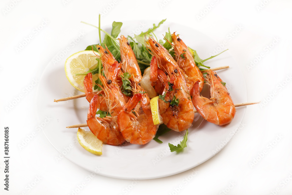 plate of shrimp skewer isolated on white background plate of shrimp skewer isolated on white background