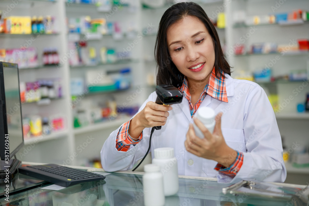 Pharmacist selling medications in the pharmacy store.