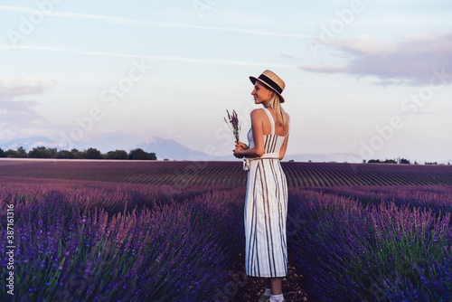 Female explorer enjoying lavender landscape in countryside countryside fields and