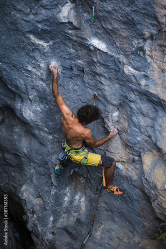 A strong man climbs a rock, Rock climbing in Turkey.