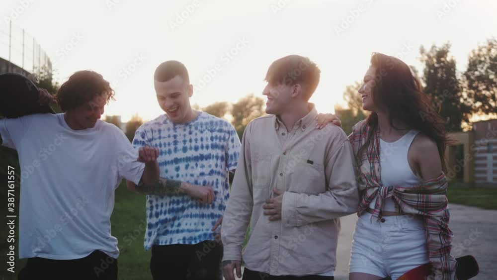 Group of Friends Walking in City Park Together, Millennial friendship concept, Generation z students, multiracial young people on alternative fashion having fun together, hip-hop and punk subculture Group of Friends Walking in City Park Together, Millennial friendship concept, Generation z students, multiracial young people on alternative fashion having fun together, hip-hop and punk subculture