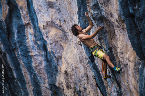A strong man climbs a rock, Rock climbing in Turkey.