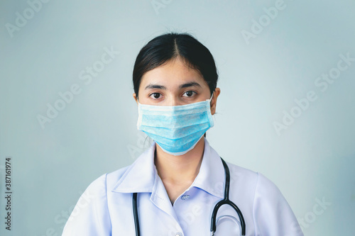 A young nurse wearing a mask to prevent germs