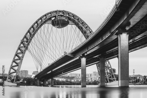 Scenic view of Zhivopisny Bridge in Moscow, Russian Federation. Photoshoot of the arch, a steel cable-stayed bridge over the Moskva River. Black and white photo