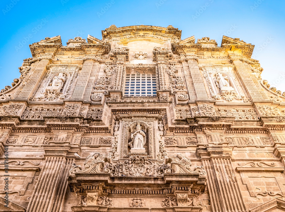 The façade of the Baroque cathedral of Sant'Agata built in the 17th century, Gallipoli, Salento, Puglia region, Italy. Facade decorated in carparo, a local limestone, with statues of saints.