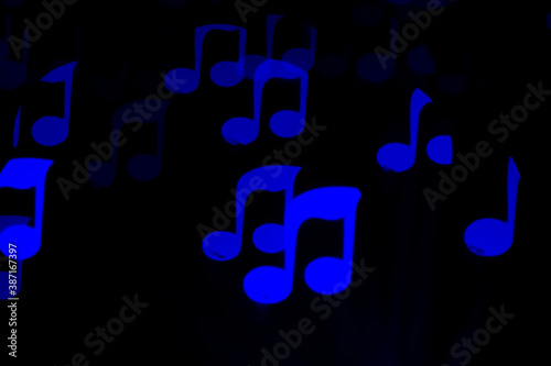 Garland in the form of notes shines on a black background.