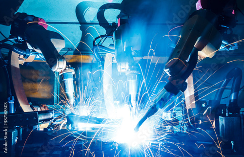 Welding robots movement in a car factory