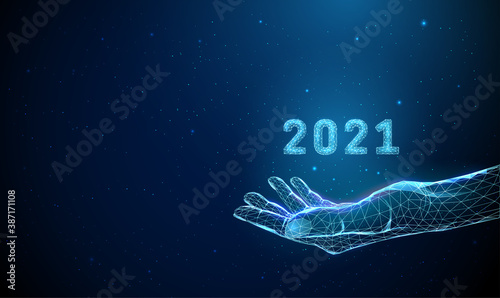 Abstract low poly giving hand with number 2021.