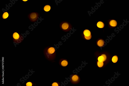 light orange abstract blurred glowing natural light effects pattern wallpaper concept on black.