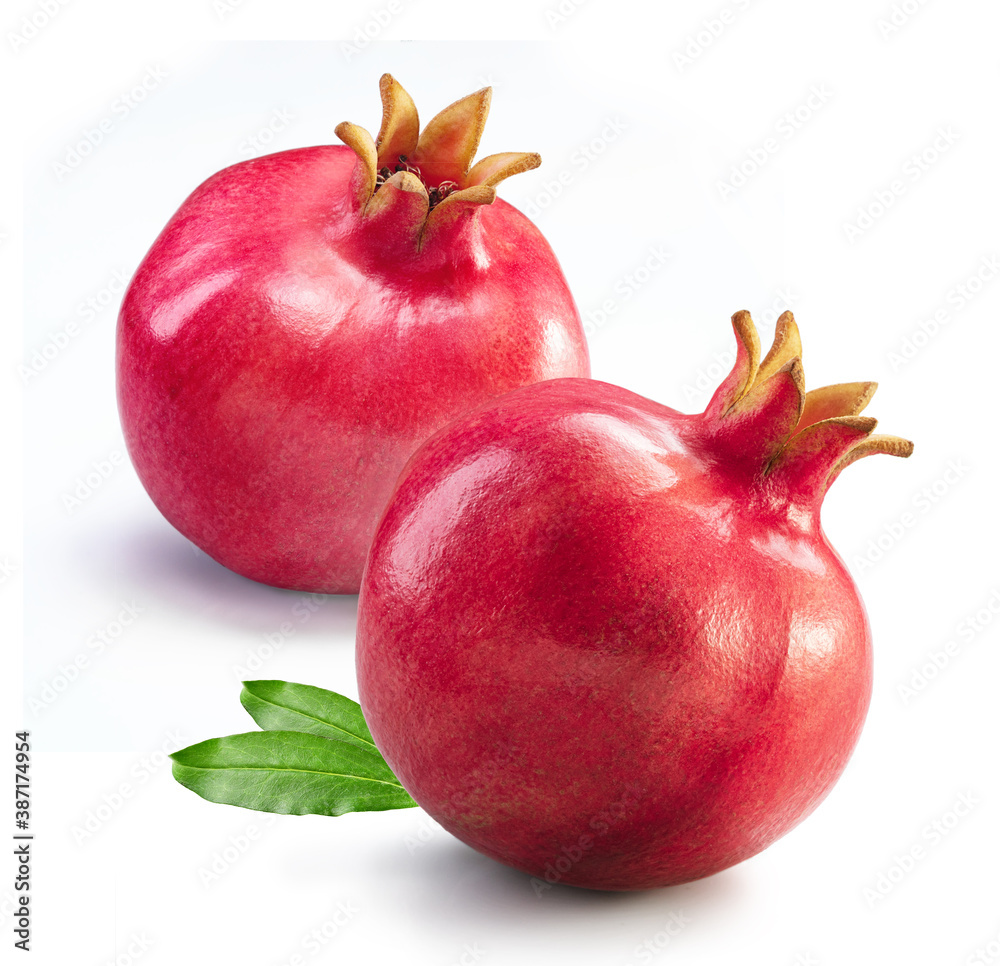Two pomegranates with leafs isolated white background Two pomegranates with leafs isolated white background