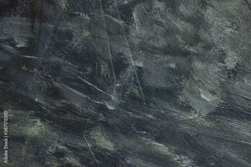 Incredibly beautiful drawing with a brush with dark gray and black and white colors. The artist uses gray and black paints.