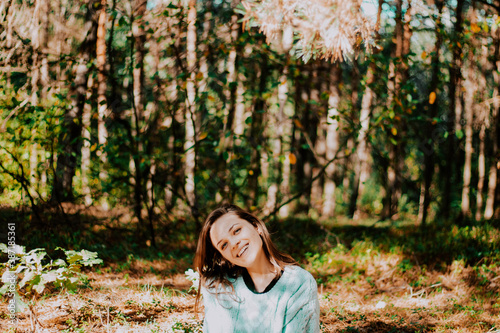 portrait of a girl with blue eyes in a turquoise sweater