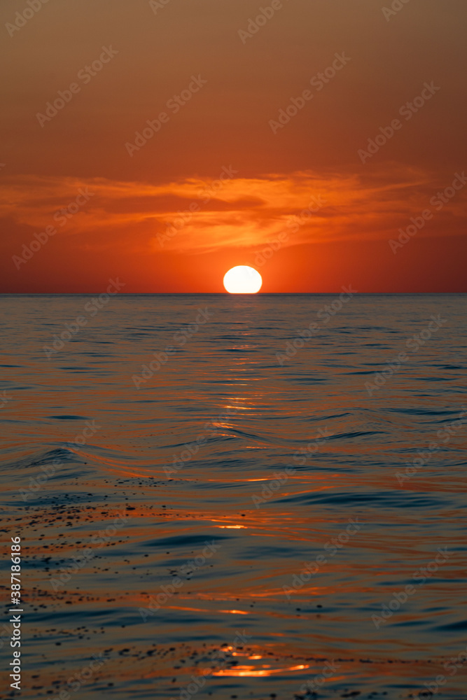 sunset at sea during calm weather