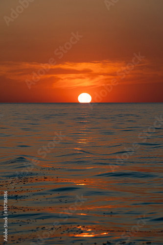 Fototapeta Naklejka Na Ścianę i Meble -  sunset at sea during calm weather
