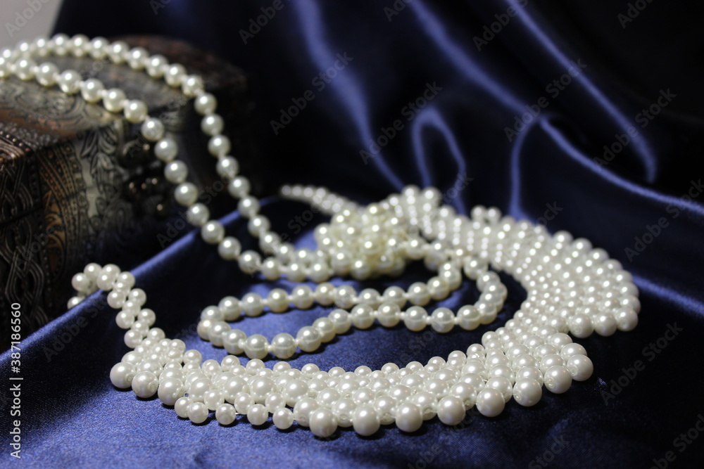 pearl necklace on black