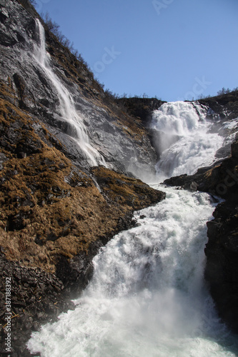 The mighty Kjosfossen waterfall. View from the train going to Myrdal