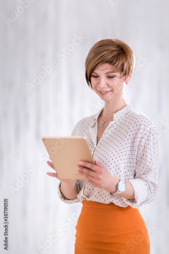 Portrait of a happy woman standing with a Notepad and pen. photo