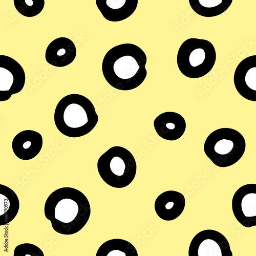geometric vector seamless pattern with hand-drawn doodle circles on an yellow background. can be used as Wallpaper, background, design of packaging paper, textiles, notebooks, clothing.