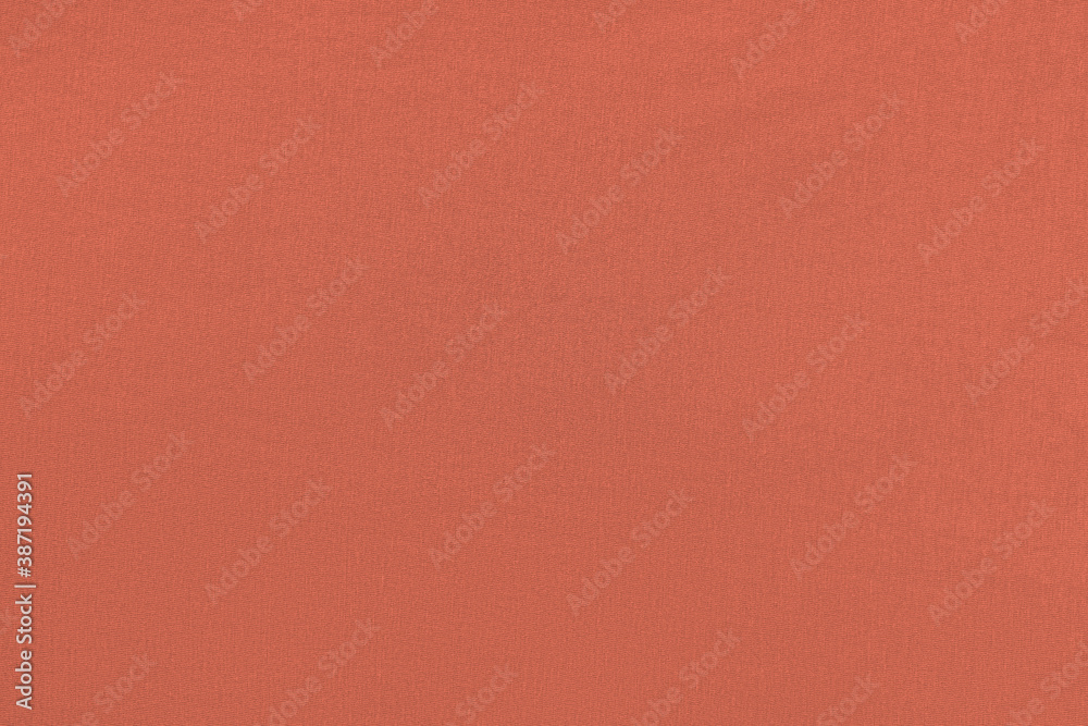 Coral homogeneous background with a textured surface, fabric. Coral homogeneous background with a textured surface, fabric.
