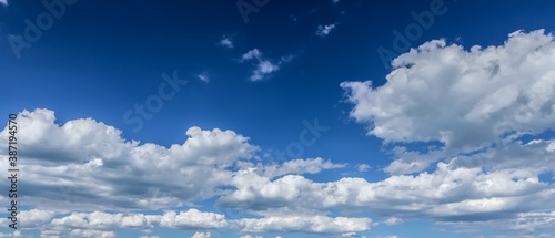 Fototapeta Naklejka Na Ścianę i Meble -  Blue sky background with fluffy clouds