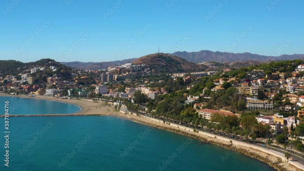 An aerial drone shot of the coastline and beach of Malaga, Andalusia, Spain. An aerial drone shot of the coastline and beach of Malaga, Andalusia, Spain.