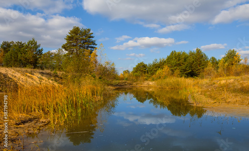 small lake in autumn forest, outdoor landscape