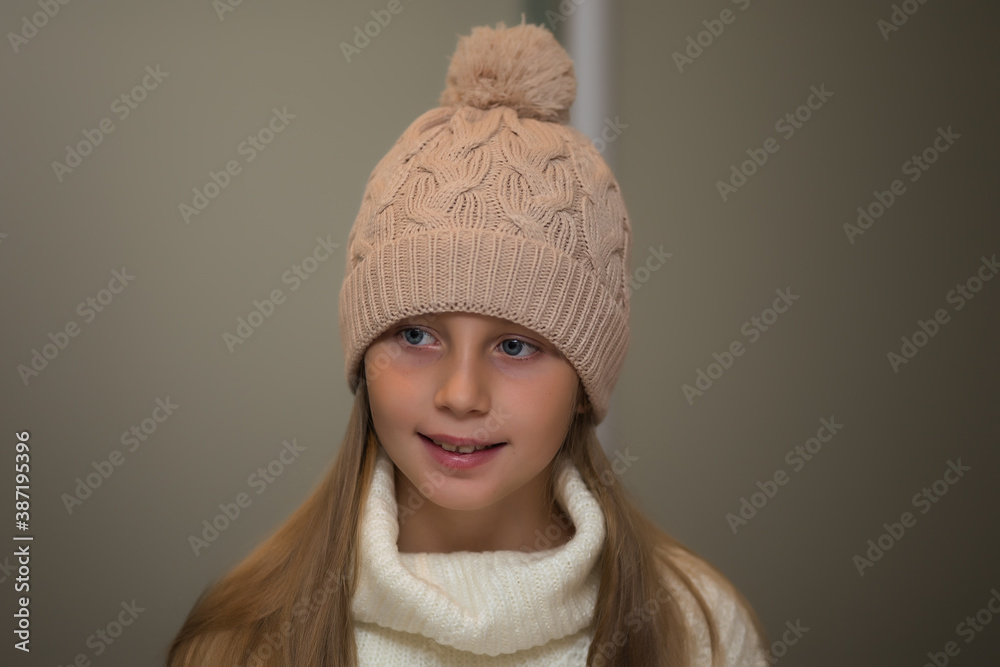 Close-up portrait of adorable smiling child girl wearing knitted hat Close-up portrait of adorable smiling child girl wearing knitted hat