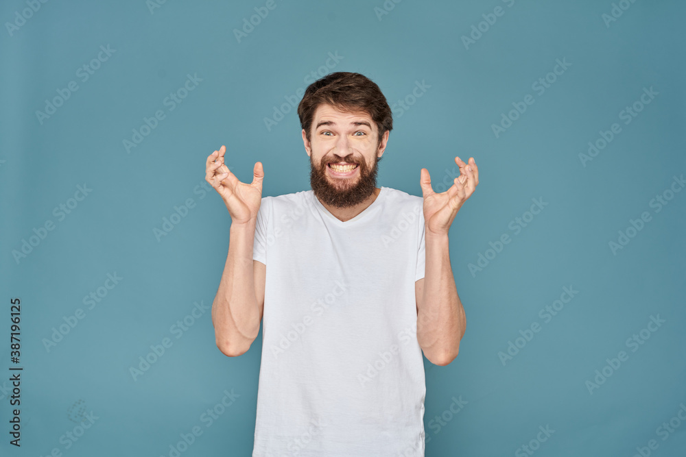 man in white t-shirt gesturing with his hands studio cropped man in white t-shirt gesturing with his hands studio cropped