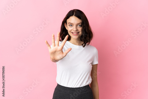 Teenager Ukrainian girl isolated on pink background counting five with fingers © luismolinero
