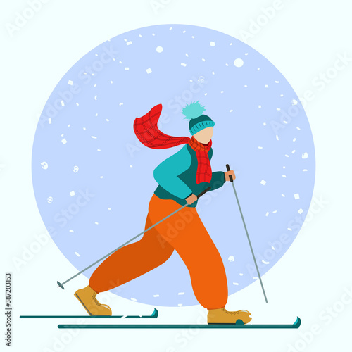 A woman goes skiing in the snow