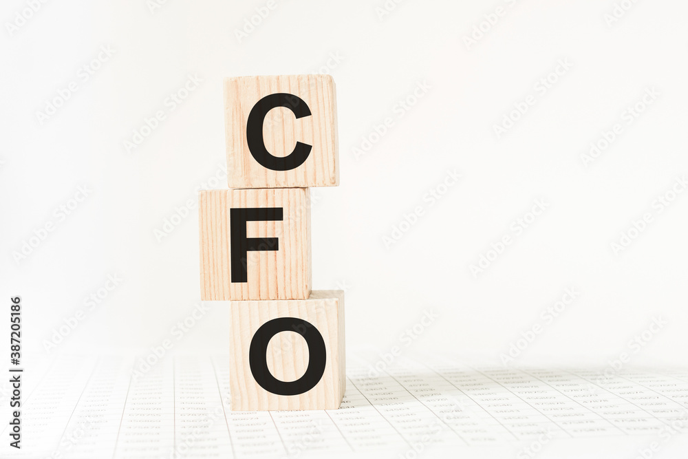 word CFO on wooden blocks, white background, business concept. business and Finance word CFO on wooden blocks, white background, business concept. business and Finance