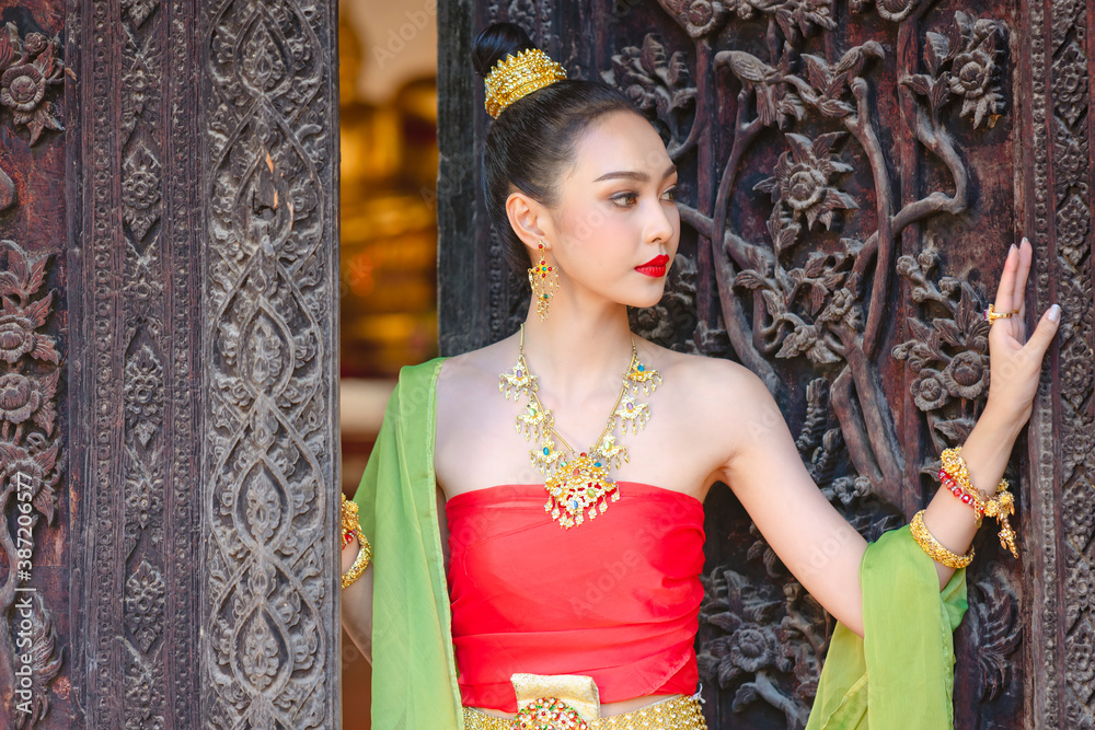 Luxury portrait of a beautiful Thai girl in traditional thai red ...