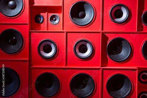 Photo of close up wall with red audio speakers background