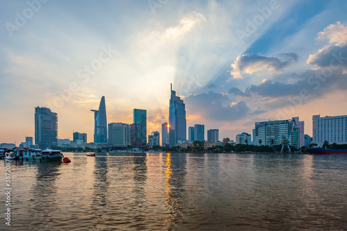 Sunset over Ho Chi Minh city , Vietnam. View from the banks of the Saigon River.  © ducvien